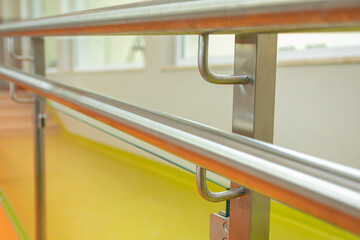 Stainless steel handrail mounted to a plugged profile post.