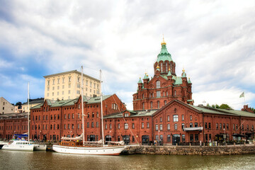 Fototapeta premium Boats Moored at Katajanokka, Helsinki, Finland, near the Uspenski Cathedral
