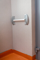 Plastic wall bumper mounted on the corridor without external bezel.