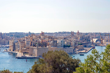 Aerial view of port and city wall at Malta island on a sunny hot summer day. Photo taken August 9th, 2017, Valletta, Malta.