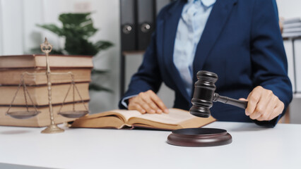 Young single female lawyer asian people in formal suit real estate working law book and contract documents, Arguments for Defense Strategy. Fight for Freedom. Supporting Evidence.