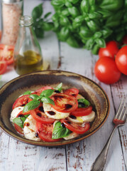 A bowl with traditional Italian caprese salad	