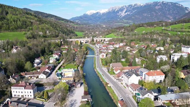 The village Payerbach in Austria with the Schwarza river and the Semmeringbahn railway viaduct crossing the river