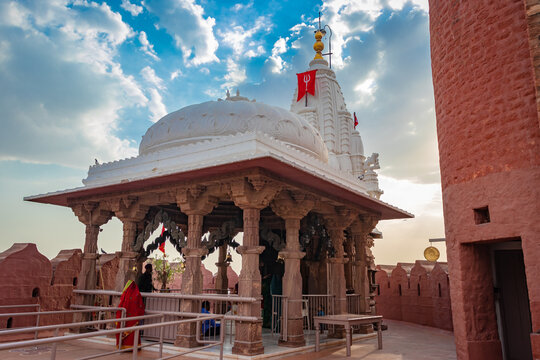 ancient temple with dramatic bright blue sunset sky at evening