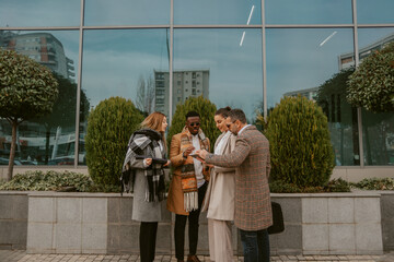 Business workers standing in front of the building