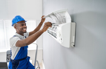 Technician Repairing Air Conditioner