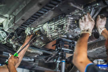 Manual transmission repair and service in garage service shop.