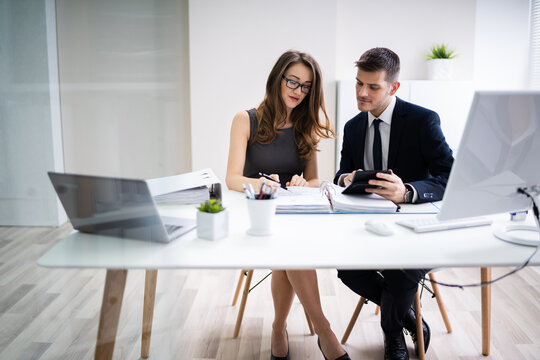 Two Business People Doing Finance Work