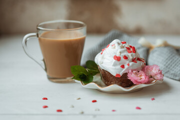 Cake and Coffee. Tasty cake with cream and pink flower decor in white plate. Good morning. Perfect breakfast