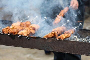 Cooking meat skewers on skewers on the grill