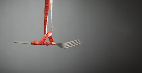 Measuring tape with fork. Diet