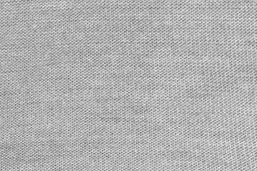 White natural texture of knitted wool textile material background. White cotton fabric woven canvas texture