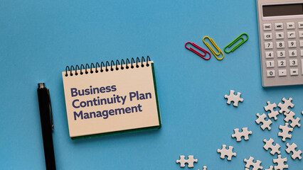 There is notebook with the word Business Continuity Plan Management.It is as an eye-catching image.