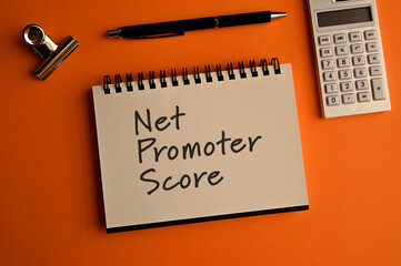 There is notebook with the word Net Promoter Score.It is as an eye-catching image.
