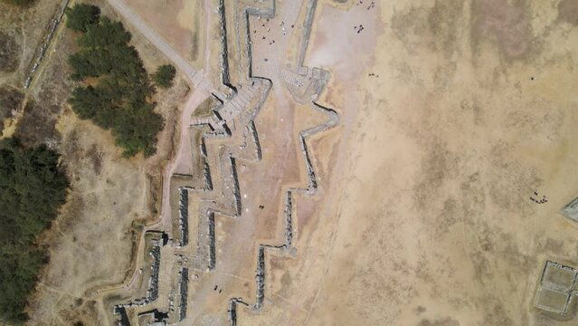 4K Aerial Drone Top Down view over Sacsayhuaman Ancient Ruins in Cusco, Peru. Traveling West