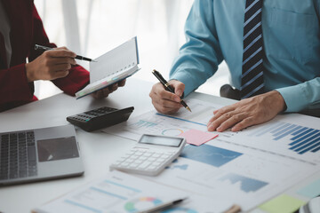 Atmosphere of a startup company meeting, business people are meeting together to summarize and plan investment finances, they are the founders of the company. Business administration concept.