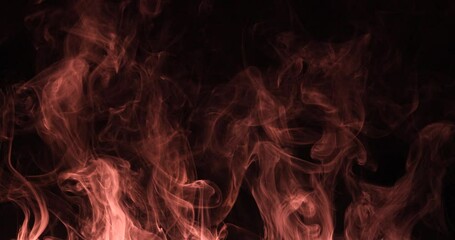 Colored smoke moves beautifully against a black background. Mockup for your logo. Wide angle horizontal wallpaper or web banner. Slow motion.