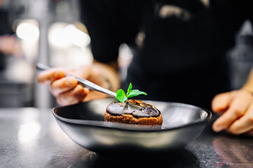 chef decorated Basque cheesecake with Chocolate and cream in bowl on kitchen