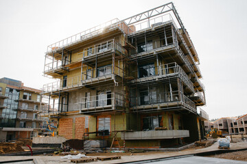 New rental property apartment housing building under construction expensive investment downtown 