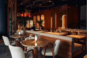 Fotobehang Hotel chique Expensive restaurant with tables served with glasses  © dimaris