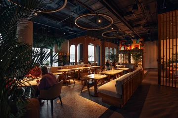 Fotobehang Hotel chique Elegant decorated restaurant with rich table settings  © dimaris