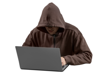 Man hacker in the hood typing on a laptop