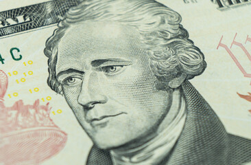 Macro shot Portrait of Alexander Hamilton on the one ten dollar bill. Background of the money. 10...