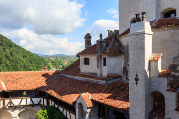 Fototapeta na wymiar The roof and walls of the famous Bran Castle (Dracula's Castle). Transylvania. Romania