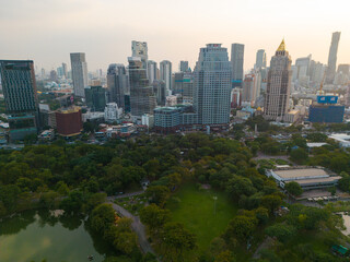 Obraz premium Lumpini park with office building in Bangkok city central of Thailand