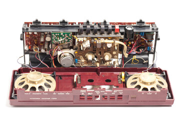 Old disassembled electronics tape recorder,