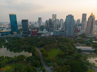Fototapeta na wymiar Lumpini park with office building in Bangkok city central of Thailand