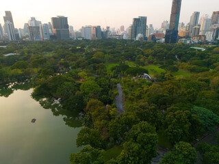 Lumpini park with office building in Bangkok city central of Thailand