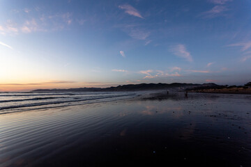 A view on the Pacific ocean shore at sunset