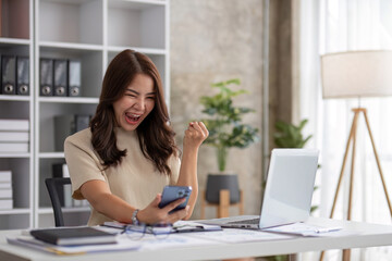 Portrait of smiling beautiful business asian woman working in office use computer with copy space. Business owner people sme freelance online marketing e-commerce telemarketing, work from home concept