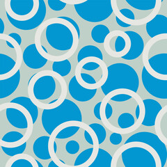 blue-white seamless vector pattern of circles and rings arranged in a chaotic form for prints on fabrics, clothing, packaging and for interior and stage decoration