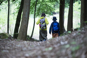 Image of climbing a mountain with parents and children in fresh and beautiful greenery Leisure and outdoor activities Whole body