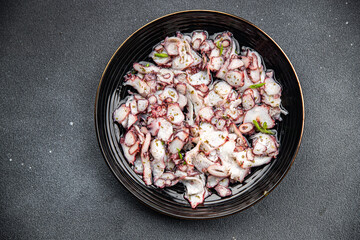octopus carpaccio marinated seafood salad healthy meal food snack on the table copy space food background rustic top view