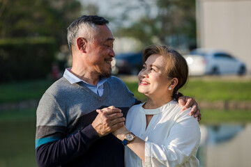 Fototapeta premium Asian Elderly couple. Happy senior couple in love. elderly couple smiling while being in a great mood. Elderly couple embracing