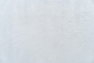 White cement or stone wall background and rough textured