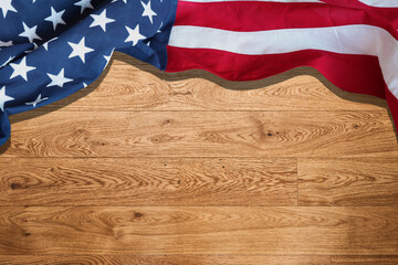 USA flag on wooden table background. American flag top view, copy space. Memorial day and 4th of...