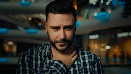 Fototapeta premium Arabian ethnicity sick ill man touch neck feel pain suffer from tonsillitis sore throat unhealthy young guy lose voice painful swallow bacterial disease covid-19 coronavirus symptom need medical help