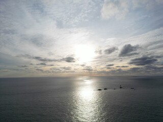 Fototapeta premium Sunset View at Land’s End Featuring Longships Lighthouse, Cornwall, UK