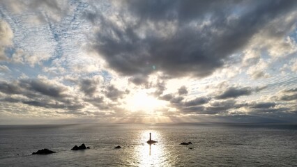 Obraz premium A view of a sunset at Land's end #longships lighthouse