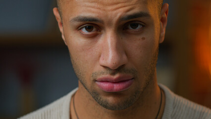 Portrait man African American adult guy serious angry pensive expression looking at camera Latino...