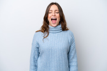 Obraz premium Young caucasian woman isolated on white background shouting to the front with mouth wide open