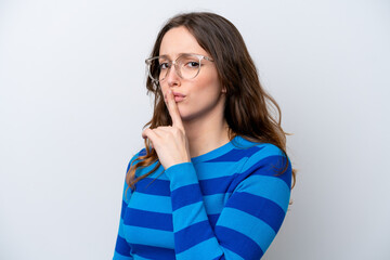 Young caucasian woman isolated on white background With glasses and doing silence gesture