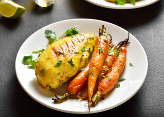 Roasted chicken breast with carrots