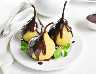 Poached pears with chocolate sauce