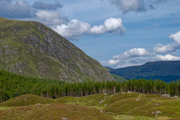 Fototapeta na wymiar Looking down Glen Doll from Corrie Fee with Craig Mellon dipping steeply down into the Valley Floor with Glacial Lorraine in the foreground.