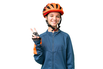 Teenager cyclist girl over isolated chroma key background smiling and showing victory sign